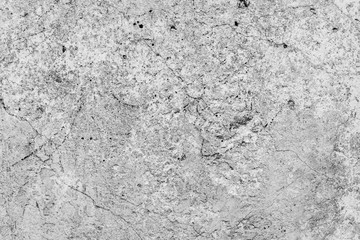 Texture of a concrete wall with cracks and scratches which can be used as a background