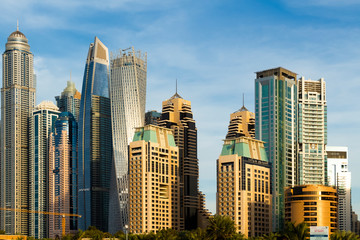 Fototapeta na wymiar View of the high-rise buildings of Dubai from the beach. Dubai Marina district.