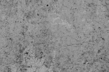Fototapeta premium Texture of a concrete wall with cracks and scratches which can be used as a background