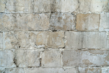background old gray stone wall polished. repaired seams between stones. Rectangular concrete blocks. Copy space.