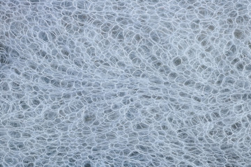 Homemade knitted warm woolen blue   female  wrap  texture