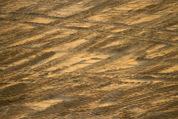 car tracks on the sand