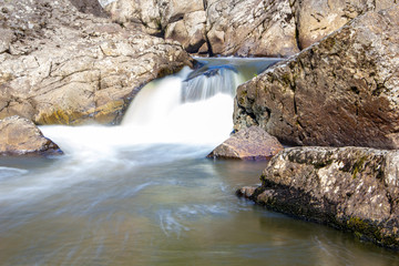 Naklejka premium beautiful waterfall on small forest river quick