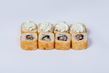 Japanese national popular cuisine. Sushi, rice and fish. Tasty, beautifully served food in a restaurant, cafe, with elements of the original design.
