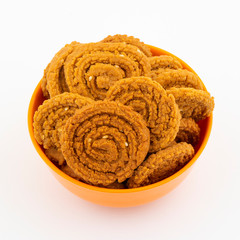 Indian Traditional Snack Chakli, a spiral shaped crisp deep fried snack, It is known as  Chakali, Murukku, Muruku, Murkoo, Chakri in Gujarat, Chakli in Maharashtra and Northern India