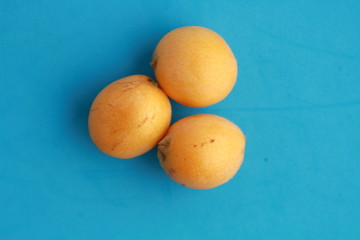 delicious yellow medlar fruit with colorful background