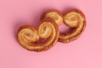 Puff pastry cookies on colorful background