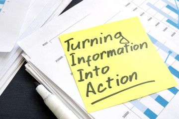 Turning information into action rule and stack of papers.