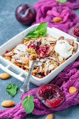 Delicious plum crumb with yogurt for Breakfast.