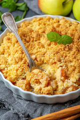 Apple crumble and a dessert spoon closeup.