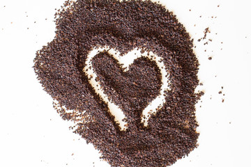 brown body scrub, on white background. Coffee scrub against cellulite. the view from the top. Sample of natural scrub. Small coffee beans. Ground caffeine. Heart