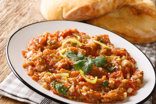 baingan bharta&nbsp;recipe, roasted eggplant curry closeup on the plate. horizontal