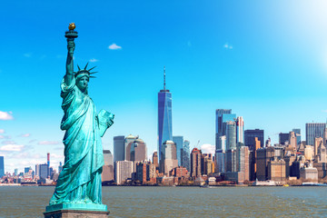 The Statue of Liberty with the One world Trade building center over hudson river and New York...