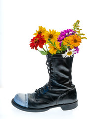 Flowers grow in military boots