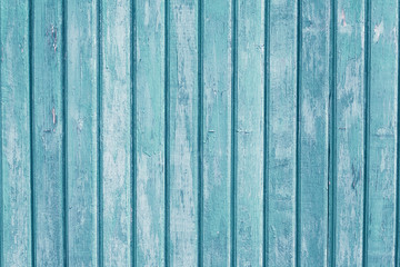 Fototapeta na wymiar Turquoise vertical wooden planks. Blue, light green painted wood background. Vintage pattern for decorative design. Old table. Grain timber texture. Exterior element. Copy space.