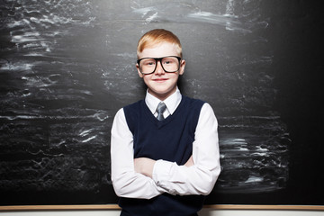 Boy near blackboard