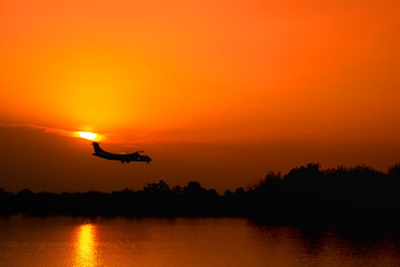 plane is about to land In the evening and Sunset