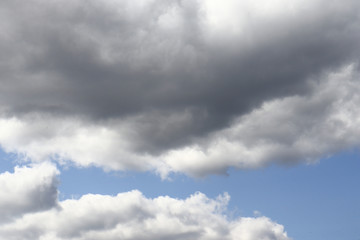 Obraz premium Blue sky with dark clouds background