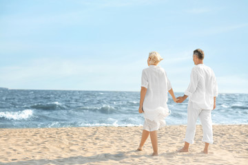 Happy mature couple at sea resort
