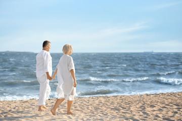Happy mature couple at sea resort