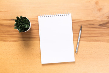 school notepad and pen on the wooden desk. spiral notepad on a tableschool notepad and pen on the...