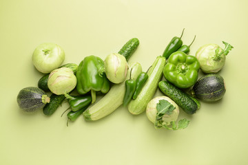 Assortment of fresh vegetables on color background