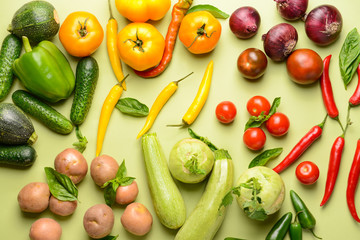 Assortment of fresh vegetables on color background