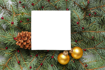 Empty greeting card with fir branches and Christmas decor