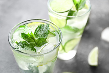 Glasses of fresh mojito on table, closeup