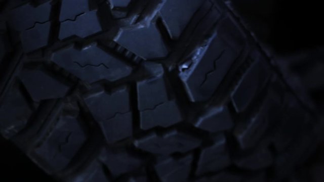 Closeup of various new tire tread. New tires of trucks, tractors and all-terrain vehicles with large tread for better grip.