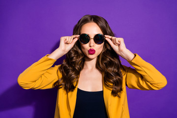 Close-up portrait of her she nice-looking lovely pretty charming cheerful cheery wavy-haired lady touching specs sending kiss isolated over bright vivid shine violet lilac purple background