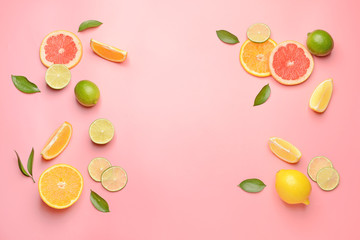 Different sliced citrus fruits on color background