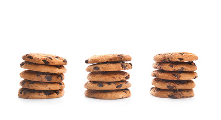 Stacked cookies with chocolate chips on white background