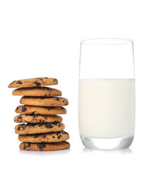 Glass of milk and tasty cookies on white background