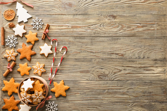 Composition with tasty Christmas cookies on wooden background