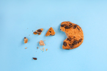Crushed cookie on color background