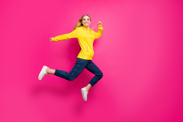 Fototapeta na wymiar Full body photo of crazy lady jumping high wear casual outfit isolated pink background
