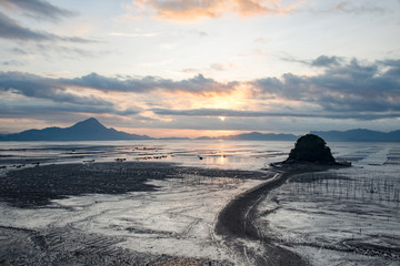 Quiet Beach Before the Sun out of the cloud