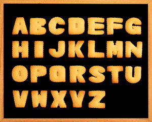 ABC biscuit in-a-row,Cookie letter alphabet on blackboard,alphabet letters (back to school concept)