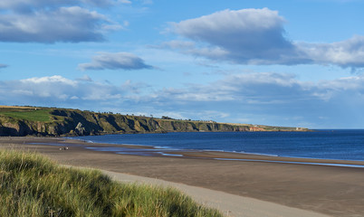 St Cyrus Beach in Aberdeenshire looking North on one Fine Autumn day, with the exposed beach from the low tide stretching away into the Distance.