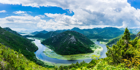Montenegro, XXL panorama of crnojevica river water bend at pavlova strana inside green valley in...