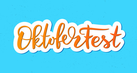 Oktoberfest typography vector design for greeting cards and poster. Beer Festival vector banner. Handwritten lettering Oktoberfest on blue background. Design template celebration. Vector illustration.