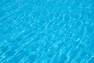 Fototapeta na wymiar Water in swimming pool. Blue background water in a pool