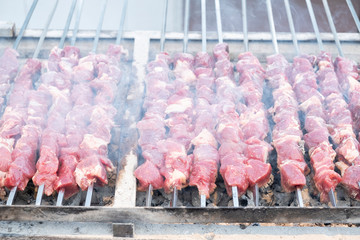 Marinated pork shashlik preparing on a skewers. . Roast Pork Kebabs. Bbq meat