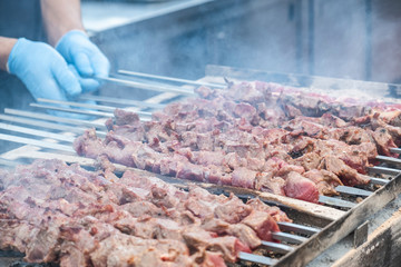 Marinated pork shashlik preparing on a skewers. . Roast Pork Kebabs