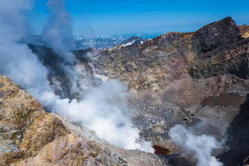 Panoramic view of the city Petropavlovsk-Kamchatsky and volcanoes: Koryaksky Volcano, Avacha Volcano, Kozelsky Volcano. Russian Far East, Kamchatka Peninsula.