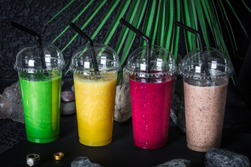 Vegan smoothies on tropical background