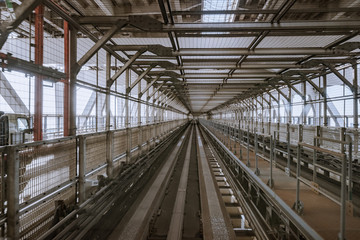 tunnel of monorail road view from front window of a moving train running
