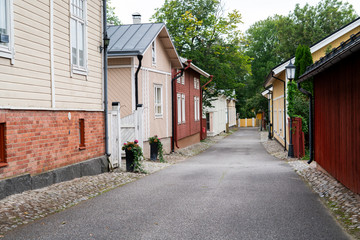 Street of Scandinavian city with traditional wooden houses.