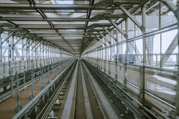 tunnel of monorail road view from front window of a moving train running